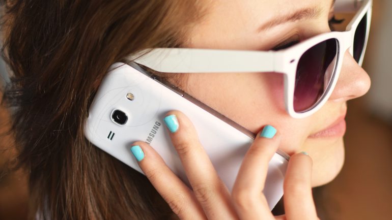 person-sunglasses-woman-smartphone.jpg